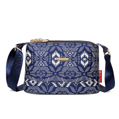 Damska torba crossbody z nadrukiem i wieloma kieszeniami